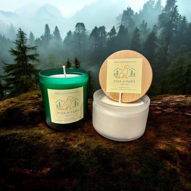 Natural scented candles displayed outdoors with a misty forest background.
